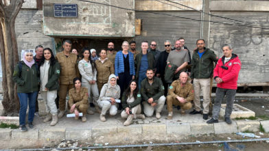 Chargée d’affaires Yngvild Berggrav (centre) flanked by Country Director Erik Paulsen and NPA’s mine action team in Yarmouk Camp