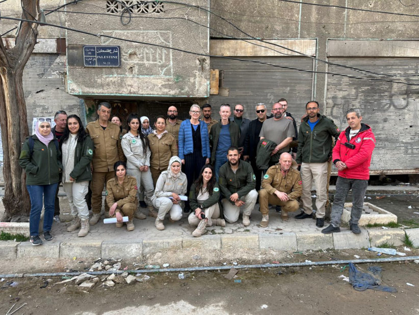 Chargée d’affaires Yngvild Berggrav (centre) flanked by Country Director Erik Paulsen and NPA’s mine action team in Yarmouk Camp