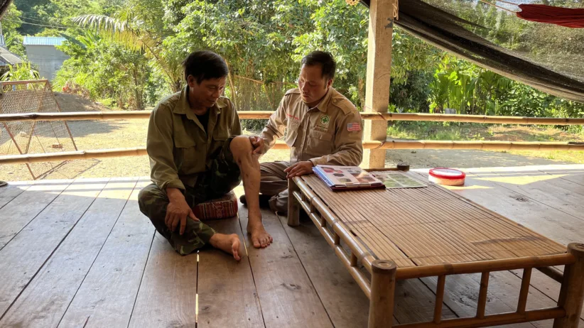243 NPA Hue NTS completion in A Luoi 220825 NPA staff interviews Mr Ho Hung 65 who was injured in 2000 after striking a 60mm