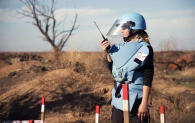 Team leader Olha gives instructions to her team on the minefield