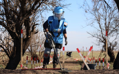 A deminer conducts technical survey on a minefield in Mykolaiv region
