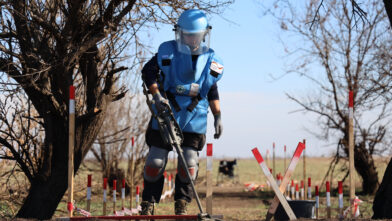 A deminer conducts technical survey on a minefield in Mykolaiv region